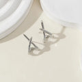 A pair of trendy geometric earrings - Cross-shaped, unique, fashionable, simple and versatile 3D jewelry for women.